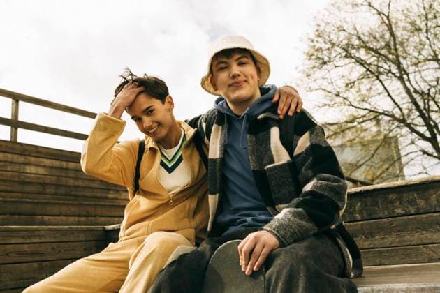 Portrait of smiling male friends sitting together on steps Sweden, Stockholm, model released Copyright: xMaskotx , MA101944 MA101944