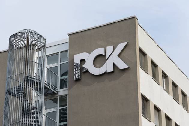 The logo of PCK Raffinerie GmbH oil processing plant. Schwedt, Germany. SCHWEDT, GERMANY - SEPTEMBER 24, 2022: The logo of PCK Raffinerie GmbH oil processing plant. The PCK refinery supplies 95 percent of the Berlin and Brandenburg areas with fuel. Copyright: xZoonar.com SergeyxKohlx 19143496