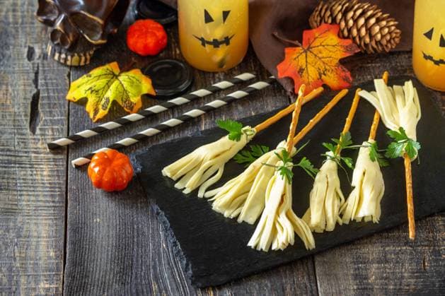 Halloween funny idea for party food. Halloween creative cheese snack on a wooden table. Copy space. Halloween funny idea for party food. Halloween creative cheese snack on a wooden table. Copy space. Copyright: xZoonar.com KHRAMOVAxxELENAx 20360174