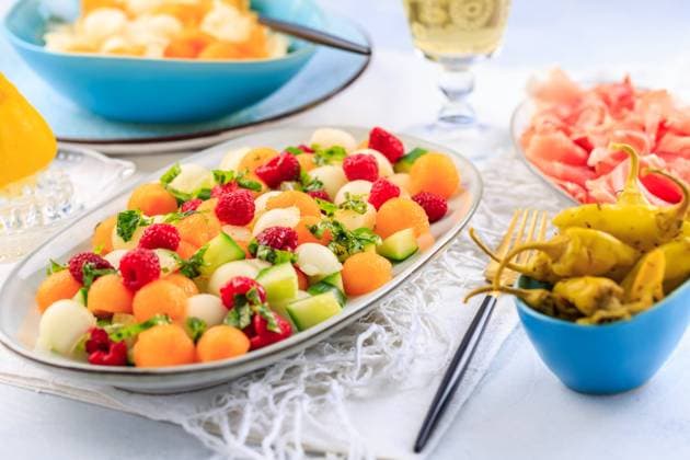 Summer light food. Cucumber and melon salad with raspberries and Prosciutto and pickled hot peppers Summer light food. Cucumber and melon salad with raspberries and Prosciutto and pickled hot peppers Copyright: xZoonar.com IngridxBalabanovax 20436688