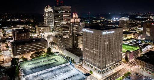 A vibrant nighttime cityscape featuring illuminated buildings and structures in the backdrop: Winston-Salem *** einer lebhaft nighttime Stadtbild featuring beleuchtet Bauwerke und Strukturen ÊIn der Kulisse Winston Salem 20403366 RECORD DATE NOT STATED