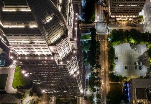 A vibrant nighttime cityscape featuring illuminated buildings and structures in the backdrop: Winston-Salem *** einer lebhaft nighttime Stadtbild featuring beleuchtet Bauwerke und Strukturen ÊIn der Kulisse Winston Salem 20403378 RECORD DATE NOT STATED