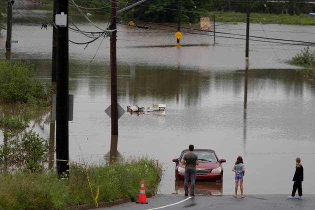 July 22, 2023, Halifax, NS, Canada: People stand at the edge of floodwater as vehicles are seen abandoned in water following a major rain event in Halifax on Saturday, July 22, 2023. A long procession of intense thunderstorms have dumped record amounts of rain across a wide swath of Nova Scotia, causing flash flooding, road washouts and power outages. Halifax Canada  - ZUMAc35_ 20230722_zaf_c35_019 Copyright: xDarrenxCalabresex