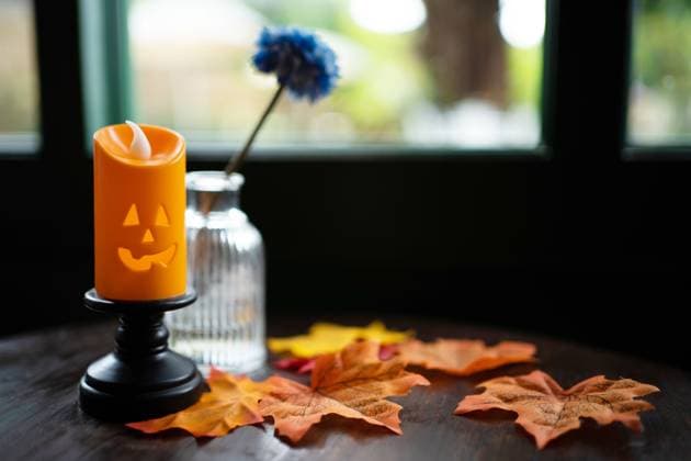 Halloween decorations background. Halloween with candle on wooden table Halloween holiday concept. Halloween decorations background. Halloween with candle on wooden table Halloween holiday Copyright: xZoonar.com SirijitxJongcharoenkulchaix 20498000