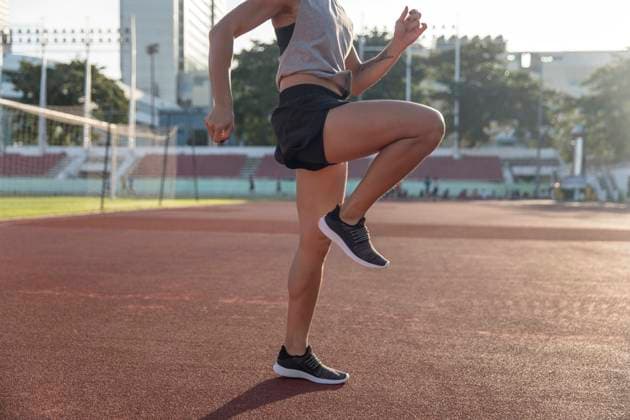 Creative Highlights Symbolbilder Young athlete warming up for exercise in sports field model released, Symbolfoto property released, IKF00857