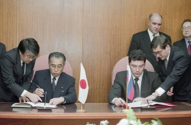 Moscow, Russia. Deputy Prime Minister of the Russian Federation Boris Nemtsov and Minister of Foreign Affairs of Japan Keizo Obuchi (R-L at the table) take part in the signing ceremony of an intergovernmental agreement on fisheries cooperation near the South Kuriles. Oleg Buldakov TASS  18371832