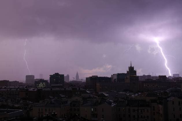 RUSSIA, MOSCOW - JULY 23, 2023: A lightning strikes as a thunderstorm rages over the city. Valery Sharifulin TASS  60629698