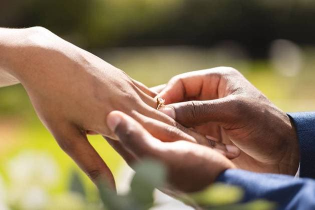 Hands of african american bride and groom placing ring on finger at wedding ceremony in sunny garden Hands of african american bride and groom placing ring on finger at wedding ceremony in sunny garden. Marriage, romance, summer, tradition, ceremony and lifestyle., model released, , property released, Cape Town, South Africa, 25.04.2023, 4108450.jpg, people,hand,african american,bride,groom,placing,ring,finger,wedding ceremony,sunny,garden,marriage,romance,summer,tradition,lifestyle,wedding,bridal,married,nature,engagement,romantic,beautiful,love,spring,outdoor,young,beauty,green,happy,flower,ceremony,plant,person,couple,african,american Young Adult,Man,Male,Black,Woman,Female