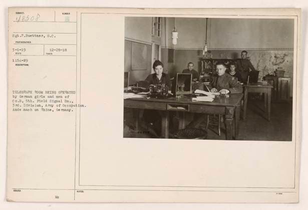 RECORD DATE NOT STATED German girls and men of Co. B, 5th Field Signal Bn, 3rd Division, Army of Occupation operating a telegraph room in Andernach on the Rhine, Germany. Photograph taken on December 28, 1918, by Sgt. P. Buettner, S.C. Image number: 48508. Copyright: xpiemagsx 972_86703125 !ACHTUNG AUFNAHMEDATUM GESCHÄTZT!