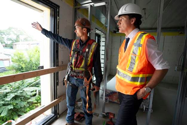 July 31, 2023, Hamilton, Ont, CAN: Prime Minister Justin Trudeau speaks with construction worker Patrick Van Dam during a visit to an apartment complex under construction in Hamilton, Ont., Monday, July 31, 2023. He was joined today by the Mayor of Hamilton, Andrea Horwath, to announce a joint investment of nearly $64 million from the Government of Canada and the City of Hamilton to build and repair 214 homes for families in the city. Hamilton CAN  - ZUMAc35_ 20230731_zaf_c35_057 Copyright: xPeterxPowerx