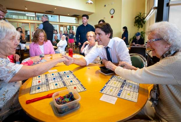 July 31, 2023, Hamilton, Ont, CAN: Prime Minister Justin Trudeau sits with a group of seniors between Bingo games during a visit to Sackville Hill Senior Recreation Centre in Hamilton, Ont., Monday, July 31, 2023. Hamilton CAN  - ZUMAc35_ 20230731_zaf_c35_075 Copyright: xPeterxPowerx