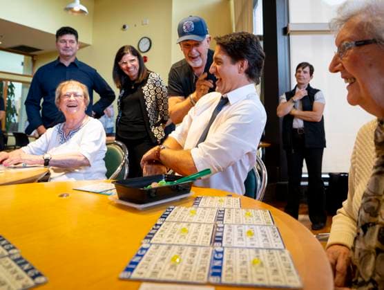 July 31, 2023, Hamilton, Ont, CAN: Prime Minister Justin Trudeau gets a light hearted warning from Robert MacDonald, 80, after the Prime Minister sat down with his girlfriend, June Browning, right, during a visit to Sackville Hill Senior Recreation Centre in Hamilton, Ont., Monday, July 31, 2023. Hamilton CAN  - ZUMAc35_ 20230731_zaf_c35_077 Copyright: xPeterxPowerx