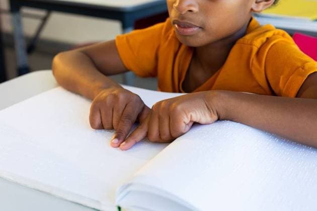Focused biracial schoolboy reading braille with hands in classroom Focused biracial schoolboy reading braille with hands in classroom. Disability, education, childhood, development, learning and school, unaltered., model released, , property released, Cape Town, South Africa, 01.04.2023, 4062107.jpg, people,focused,biracial,schoolboy,reading,braille,hand,classroom,disability,education,childhood development,learning,school,unaltered,study,student,knowledge,studying,class,university,college,lesson,book,learn,teacher,elementary,disabled,pupil,childhood,kid,library,homework,teaching,literature,development Child,Boy,Male,Multiracial
