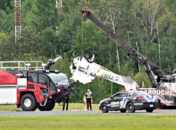 August 1, 2023, QUEBEC, PQ, Canada: A Cessna 152 aircraft is towed away after it crashed on landing at the Jean-Lesage Airport in Quebec City, Tuesday, Aug. 1, 2023. One person was reported injured. QUEBEC Canada  - ZUMAc35_ 20230801_zaf_c35_023 Copyright: xJacquesxBoissinotx