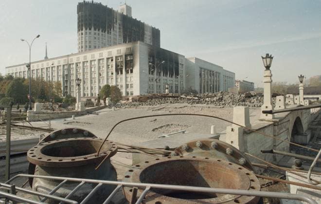 Moscow, Russia. The view shows barricades near the Gorbaty Bridge, built by supporters of the Russian parliament, and the House of Soviets of the Russian Federation damaged by tank fire of the Taman Division on October 4, 1993 during the storming of the building by supporters of the Russian President within a standoff between the Supreme Soviet of the Russian Federation and Russian President Boris Yeltsin. Valery Khristoforov TASS  32409486