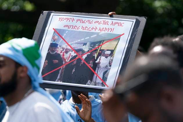 August 5, 2023, Toronto, ON, Canada: A protestor holds a sign in Earlscourt Park in Toronto, on Saturday, August 5 2023. Toronto police say one person was stabbed and eight others were injured during a protest in the cityöÄÃ s west end. Toronto Canada  - ZUMAc35_ 20230805_zaf_c35_045 Copyright: xArlynxMcadoreyx