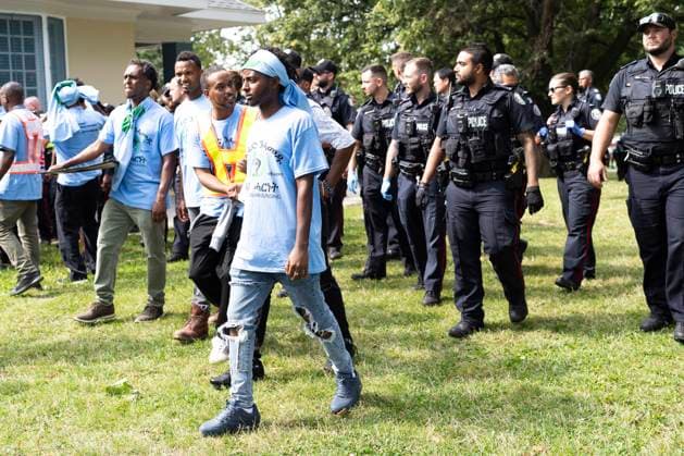 August 5, 2023, Toronto, ON, Canada: Toronto Police work the scene of a protest that turned violent in Earlscourt Park in Toronto, on Saturday, August 5 2023. Toronto police say one person was stabbed and eight others were injured during a protest in the city s west end. Toronto Canada  - ZUMAc35_ 20230805_zaf_c35_007 Copyright: xArlynxMcadoreyx