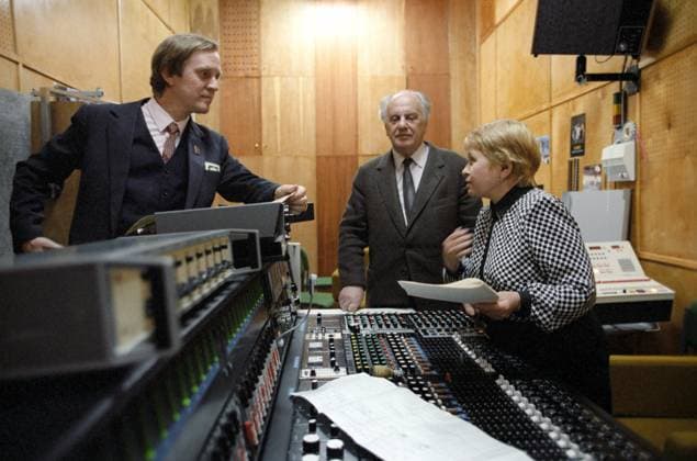 Moscow, USSR. Soviet opera and pop singer Leonid Smetannikov, poet Yevgeny Dolmatovsky and composer Alexandra Pakhmutova (L-R) record the In Honour of Victory song in the studio. Yuri Lizunov TASS  1204963