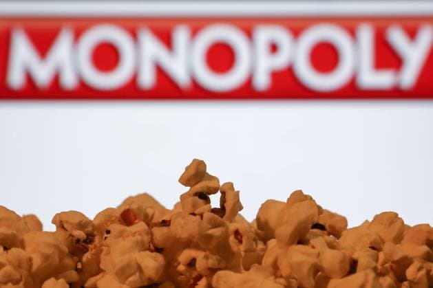 Movie Industry Photo Illustrations A popcorn and Monopoly logo displayed on a screen in the background are seen in this illustration photo taken in Krakow, Poland on August 7, 2023. Krakow Poland  Copyright: xJakubxPorzyckix originalFilename: porzycki-movieind230807_npAjw.jpg
