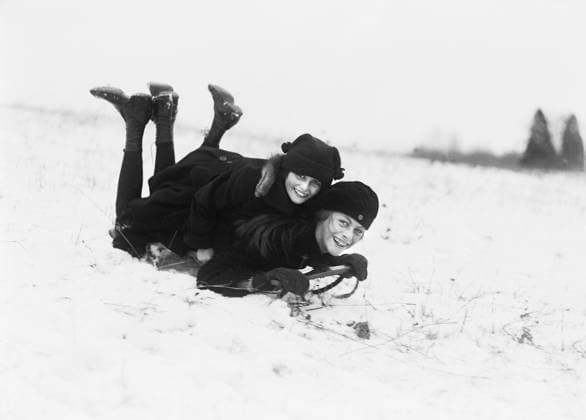 Two Smiling Girls riding on Snow Sled, Washington DC, USA, Harris & Ewing, 1920  Copyright: xCircaxImagesx ghi-circa01088