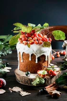Christmas New Year cake covered with icing and decorated with glazed fruits and berries. wooden dark background, holiday concept. Christmas greeting card Christmas New Year cake covered with icing and decorated with glazed fruits and berries. wooden dark background, holiday concept. Christmas greeting card Copyright: xJuliaxBogdanovax JBO260623-9