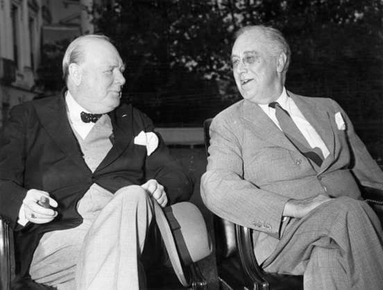 Churchill and Roosevelt Washington D.C. Prime Minister Winston Churchill and President Roosevelt relax in the south grounds of the White House prior to the daily meeting of the combined British and U.S. Chief of Staffs who have resumed their conferences on Allied war strategy. President Roosevelt is telling Mr Churchill about his beautiful rose gardens. 1943 Date: 1943  Copyright: Copyrightx(c)Geminix2023.xCredit:xGemini 10982480