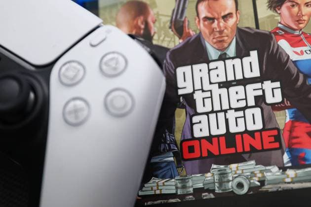 GTA V PlayStation Game Photo Illustration PlayStation DualSense controller and Grand Theft Auto Online game are seen in this illustration photo taken in Krakow, Poland on August 10, 2023. Krakow Poland  Copyright: xJakubxPorzyckix originalFilename: porzycki-gtavplay230810_npdcA.jpg