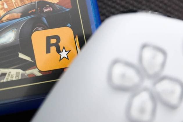 GTA V PlayStation Game Photo Illustration Rockstar Games logo on Grand Theft Auto V game packaging and PlayStation DualSense controller are seen in this illustration photo taken in Krakow, Poland on August 10, 2023. Krakow Poland  Copyright: xJakubxPorzyckix originalFilename: porzycki-gtavplay230810_npO8Z.jpg