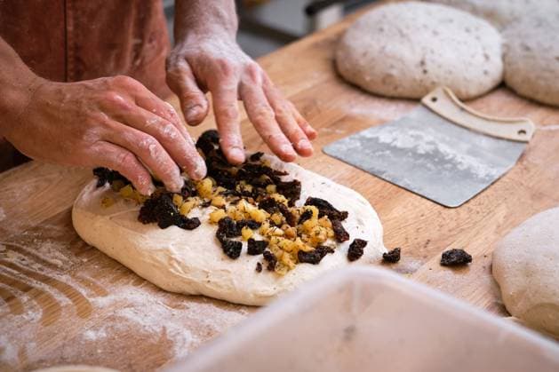 Detail of a baker s hands introducing ingredients into the bread dough. Detail of a baker s hands introducing ingredients into the bread dough. . High quality photo Model Released PhilippeDegroote_ID14492_436185_037 Copyright: xPhilippexDegrootex