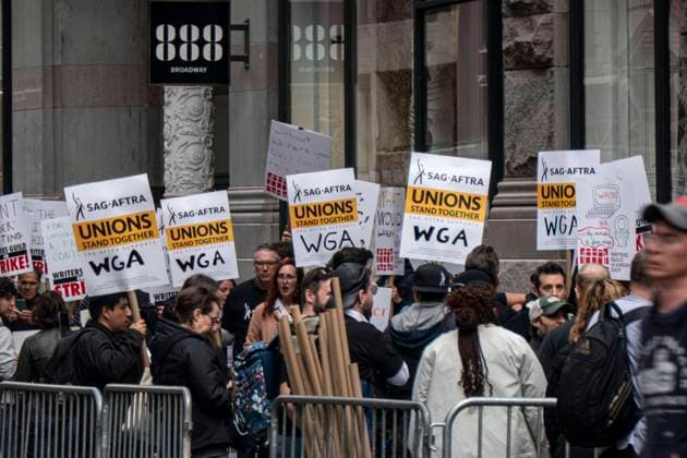 Writers Guild On Strike In New York City Scriptwriters march on strike on second day of the strike with the attendance of actors and actresses, including Susan Sarandon at Netflix Headquarters near Union Square. Members of the Writers Guild of America East WGA, SAG AFTRA hold signs as they walk for the second day on the picket line, many union members raised concerns that they are not being paid fairly in the streaming era and are seeking pay increases, rights fair share and structural changes to the business model. New York City, NY, United States of America on May 3, 2023 New York City United States  Copyright: xNicolasxEconomoux originalFilename: economou-writersg230503_npqLe.jpg