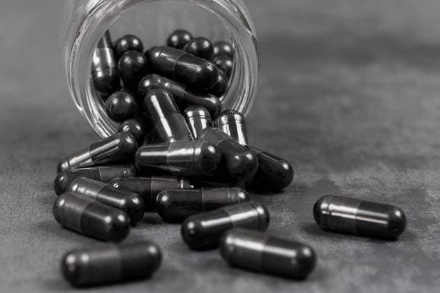Phytotherapy Vegetable charcoal capsules, organic food supplement. Copyright: xCHASSENETx xBSIPx 016783_059 Bsip_016783_059 model release