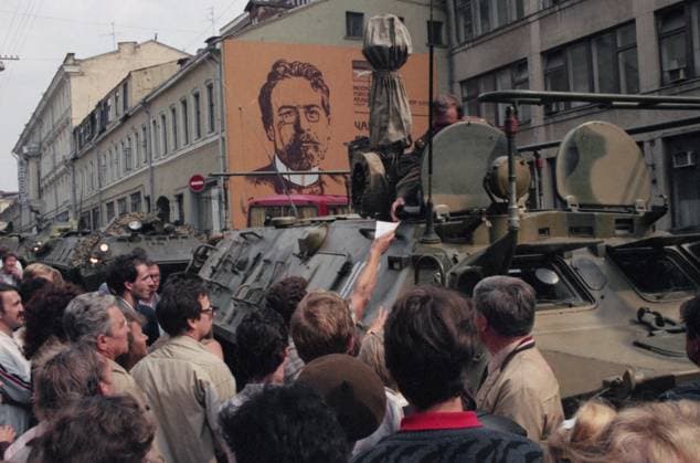 Moscow, USSR. Civilians gather near the armoured personnel carriers at the Moscow Arts Theatre during the State Committee on the State of Emergency (GKChP) members coup attempt. In order to prevent the signing of the Union Treaty, which has to replace the USSR by the new federation of sovereign states, the representatives of top Soviet leadership, headed by Vice-President of the USSR Gennady Yanayev removed the USSR President mikhail Gorbachev from power and declared state of emergency. Gennady Khamelyanin TASS  32444764
