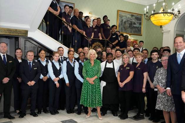 Bilder des Jahres 2023, Entertainment 08 August Entertainment Themen der Woche KW35 Entertainment Bilder des Tages Britain s Queen Camilla poses for a photograph with members of staff at the Royal Air Force Club in London, Tuesday, Aug. 29, 2023. Her Majesty The Queen unveiled a portrait of SOE Operative, Noor-un-Nisa Inayat Khan GC, and formally announced the name of a room in her honour at the Royal Air Force Club., Credit:Kirsty Wigglesworth Avalon GBR, London  Copyright: xKirstyxWigglesworthx xAvalonx 0801085821
