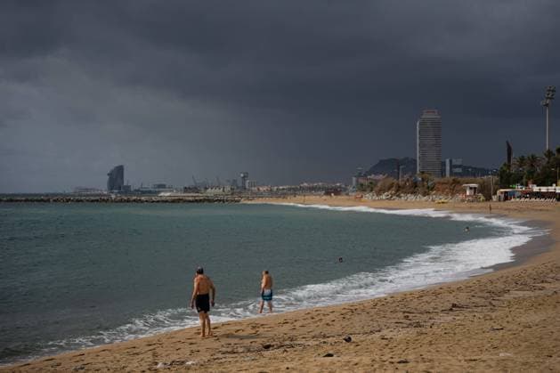 August 30, 2023, Barcelona, Barcelona, Spain: People bathe on a Barcelona beach after a stormy morning. Temperatures in Spain have dropped across the board this past week, after one of the hottest summers on record. Barcelona Spain - ZUMAa239 20230830_zip_a239_027 Copyright: xMarcxAsensioxClupesx