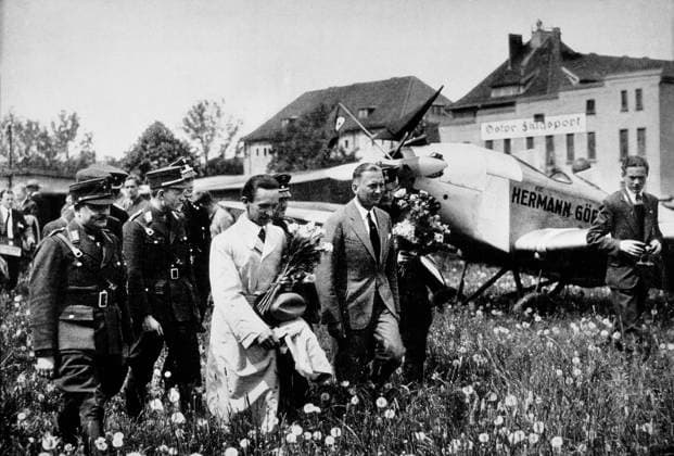 Joseph Goebbels, Center Foreground, Wearing White Trench coat and Holding Flowers, At Konigsberg Airport, East Prussia, 1933  Copyright: xABxArchivex jtv001982