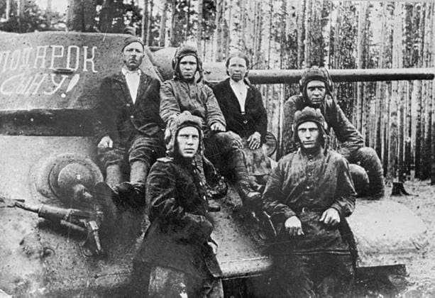 WWII SHIRMANOVS TANK GIFT SON 1233 01.06.1943 The tank Gift to the Son was built on the money of collective farmers Maria and Ilya Shirmanov (their son Andrei, center). Sputnik Russia  Copyright: xx