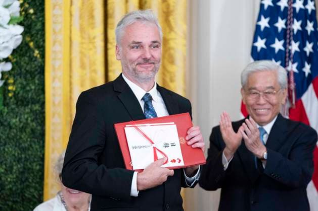 Director for the Rural Studio Andrew Freear receives a diploma as a recipient if the Praemium Imperiale Grant for Young Artists, a program to support young artists work and activities, during an event in the East Room of the White House in Washington, DC on Tuesday, September 12, 2023.  WAP20230912367 BONNIExCASH