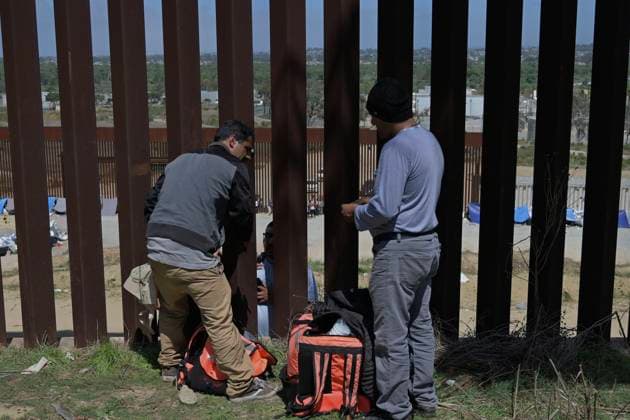 September 12, 2023, Tijuana, Baja California, Mexico: Around a hundred people are stuck between the two US-Mexico border fences dividing Tijuana and San Diego on Tuesday, September 12, 2023, as viewed from Tijuana, Mexico. The migrants are from countries in South America, Central Asia, Eastern Europe and Africa. All are seeking a chance to enter the US via asylum status, as some lost patience in the process of getting appointments through the CBP One application and crossed illegally out of desperation, some waiting months. Migrants claim that the appointment system is over saturated and is difficult to obtain access on the phone app. Tijuana Mexico - ZUMAm180 20230912_zip_m180_005 Copyright: xCarlosxA.xMorenox