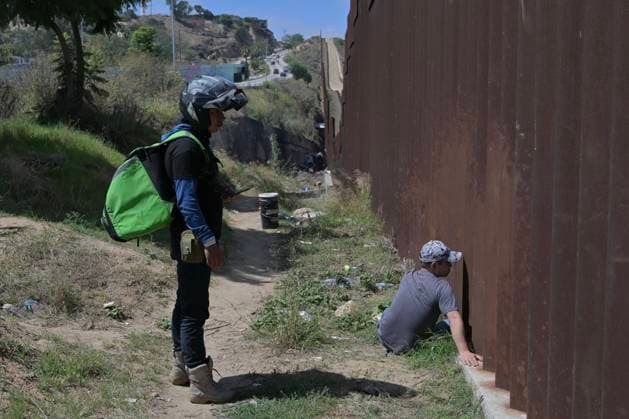 September 12, 2023, Tijuana, Baja California, Mexico: Around a hundred people are stuck between the two US-Mexico border fences dividing Tijuana and San Diego on Tuesday, September 12, 2023, as viewed from Tijuana, Mexico. The migrants are from countries in South America, Central Asia, Eastern Europe and Africa. All are seeking a chance to enter the US via asylum status, as some lost patience in the process of getting appointments through the CBP One application and crossed illegally out of desperation, some waiting months. Migrants claim that the appointment system is over saturated and is difficult to obtain access on the phone app. Tijuana Mexico - ZUMAm180 20230912_zip_m180_010 Copyright: xCarlosxA.xMorenox