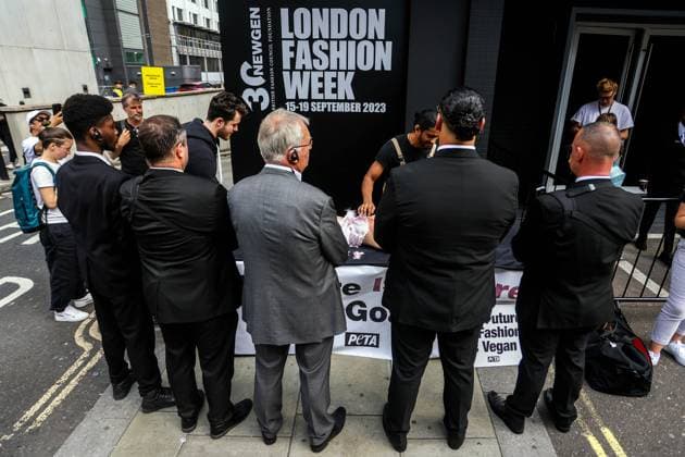 . 15 09 2023. London, United Kingdom. PETA Protest London Fashion Week Over Cashmere Garments. London Fashion Week security guards try to block PETA protest from public view. PETA supporters hold a goat combing outside the British Fashion Council s (BFC) NEWGEN Show Space to demonstrate what happens in the industry. A worker will pin down a screaming and nearly nude PETA supporter dressed as a goat and tear their hair out with a giant silver comb, leaving them with bloody wounds.  xMartynxWheatleyx xi-Imagesx IIM-24676-0011