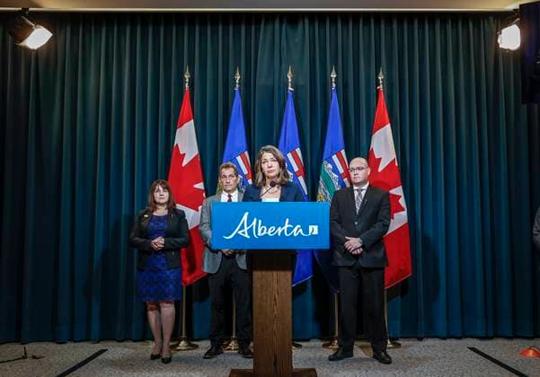 September 15, 2023, Calgary, AB, CANADA: Alberta Premier Danielle Smith, centre, speaks to the media about an E-coli outbreak at several Calgary daycares, as, left to right, Adriana LaGrange, Minister of Health, Dr. Mark Joffe, Alberta chief medical officer of health, and Searle Turton, Minister of Children and Family Services, look on in Calgary, Alta., Friday, Sept. 15, 2023. Calgary CANADA - ZUMAc35_ 20230915_zaf_c35_034 Copyright: xJeffxMcintoshx