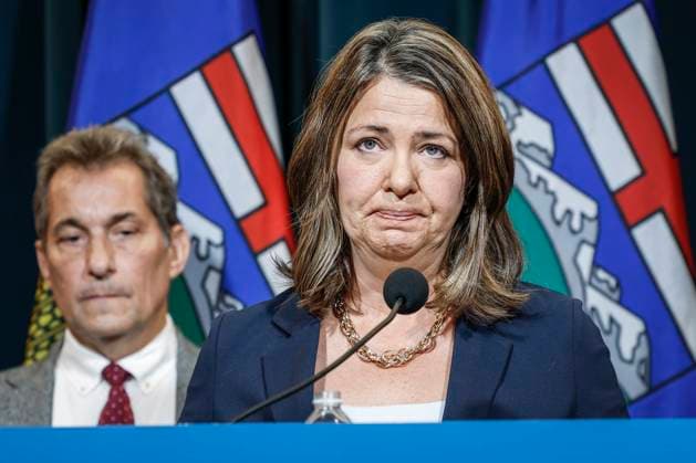 September 15, 2023, Calgary, AB, CANADA: Alberta Premier Danielle Smith, right, becomes emotional as she speaks to the media about an E-coli outbreak at several Calgary daycares as Dr. Mark Joffe, Alberta chief medical officer of health, looks on in Calgary, Alta., Friday, Sept. 15, 2023. Calgary CANADA - ZUMAc35_ 20230915_zaf_c35_035 Copyright: xJeffxMcintoshx