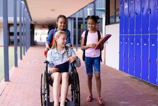 Happy diverse schoolgirl in wheelchair with her friends in corridor at school Happy diverse schoolgirl in wheelchair with her friends in corridor at school. Education, inclusivity, school, learning and disability concept., model released, , property released, Cape Town, South Africa, 05.11.2022, 3908116.jpg, people,happy,diverse,schoolgirl,wheelchair,friend,corridor,school education,inclusivity,back to school,learning,disability,concept,disabled,handicapped,handicap,education,young,invalid,school,student,person,fun,smile,studying,lifestyle,cute,study,cheerful,childhood,design,kid Child,Girl,Female,White