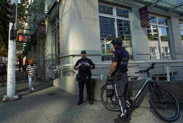 (230922) -- VANCOUVER, Sept. 22, 2023 -- Vancouver police officers are seen outside the building where the office of the Consulate General of India is located in Vancouver, Canada, on Sept. 21, 2023. The Vancouver Police Department is beefing up security outside the office of the Consulate General of India. Canada has expelled a top Indian diplomat for his alleged involvement in the assassination of Canadian Sikh leader Hardeep Singh Nijjar in the Canadian province of British Columbia in June, Foreign Minister Melanie Joly said Monday. (Photo by Xinhua) CANADA-VANCOUVER-CONSULATE GENERAL OF INDIA-SECURITY LiangxSen 
