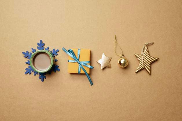 Christmas ornament and gift box on brown background. Christmas winter decoration. flat lay, top view, copy space Christmas ornament and gift box on brown background. Christmas winter decoration. flat lay, top view, copy space Copyright: xZoonar.com SangaxParkx 19511219