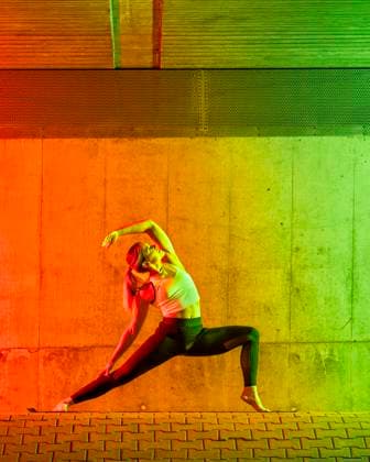 Active woman doing yoga near neon colored wall model released, Symbolfoto, STSF03774