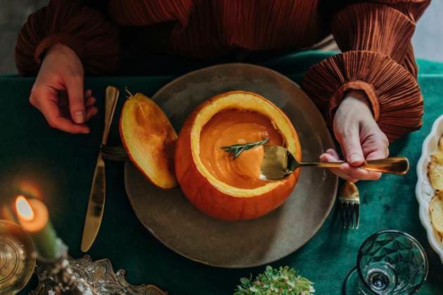 Woman having pumpkin soup at dining table model released, Symbolfoto property released, VSNF01359