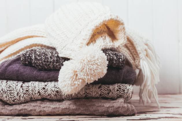 Collection of woolen clothes Stack warm knitted sweaters, scarf and hat in white and gray shades ,model released, Symbolfoto Copyright: xZoonar.com OksanaxShufrychx 9925937 ,model released, Symbolfoto ,property released