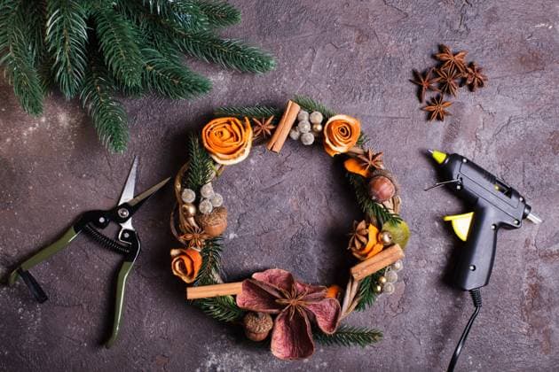 Christmas aromatic wreath DIY Christmas aromatic eco wreath with dry orange and anise stars, decorated tangerine peel roses, closeup details Copyright: xZoonar.com OksanaxShufrychx 11462318