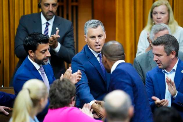October 3, 2023, Ottawa, ON, CAN: Candidate for Speaker and member of Parliament Peter Schiefke shakes hands with fellow candidate Greg Fergus after delivering a speech in the House of Commons prior to voting on Parliament Hill in Ottawa on Tuesday, Oct. 3, 2023. Ottawa CAN  - ZUMAc35_ 20231003_zaf_c35_053 Copyright: xSeanxKilpatrickx